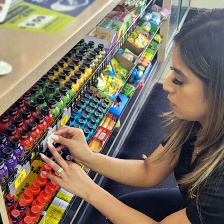 Street Team 5 adjusting 5-hour ENERGY rack display